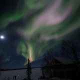 Moon with multi color aurora borealis Yellowknife VacationsJPG
